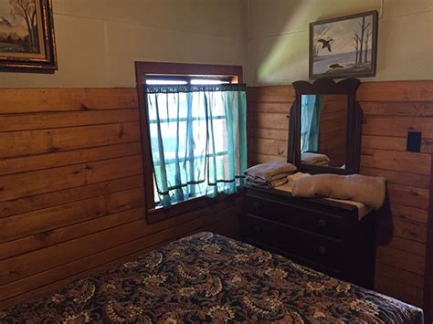 Newly built lakefront, log home offers 3 bedrooms, 2 baths, great room with stone fireplace,gourmet kitchen, large deck,and sandy beach. Cabin Rentals on Brevort Lake | Black Point Resort