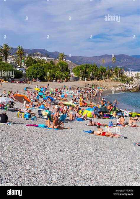 Bathers On The Pebble Beach Of La Herradura Costa De Tropical Granada