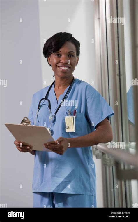 Portrait Of A Female Nurse Holding A Clipboard Stock Photo Alamy