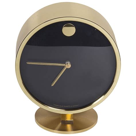 Shisedeco mid century george nelson ball clock, painted solid wood non ticking decorative modern silent wall clock for home, kitchen infinity instruments orb spoke midcentury modern 15 inch retro starburst ball wall clock quiet quartz movement mid century decorative, multicolor. Gorgeous Brass Midcentury Desk Clock | From a unique ...