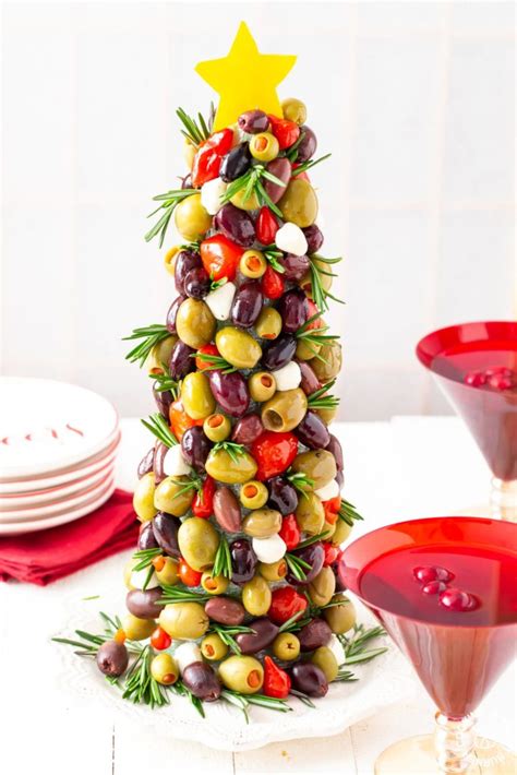 Using christmas centerpieces on your dinner table is a simple way of making your house more festive for the holidays. Olive Christmas Tree Appetizer | Cooking on the Front Burner