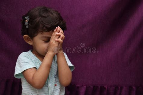 Cute Little Child Is Praying Girl Is Wishing Something Stock Photo