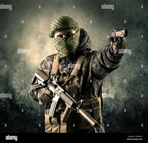 Portrait Of A Heavily Armed Masked Soldier With Grungy Background