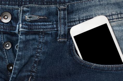 Premium Photo Smartphone In Pocket Jeans
