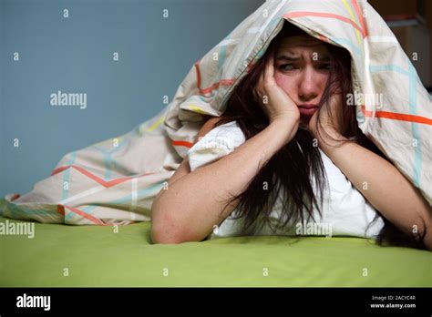 Young Woman Sleeping Under Blanket Hi Res Stock Photography And Images