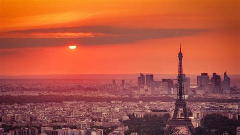 Paris Eiffel Tower And France Cityscape With Orange Sky Background