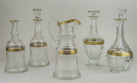 Moser Glass A Group Of Vintage Gilt Decorated Items Including A Jug And Four Decanters With