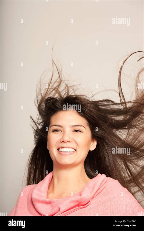 Headshot Of A Young Woman Hair Flying Stock Photo Alamy