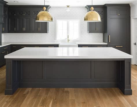 White was used for the base color of walls, the tiled backsplash and the white quartz countertops. Hot New Kitchen Trend: Dark Cabinets, Subway Tile & Shiplap - Home Bunch Interior Design Ideas
