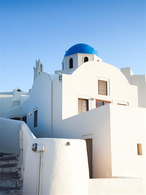 White Buildings And Blue Church In Oia Santorini Greece