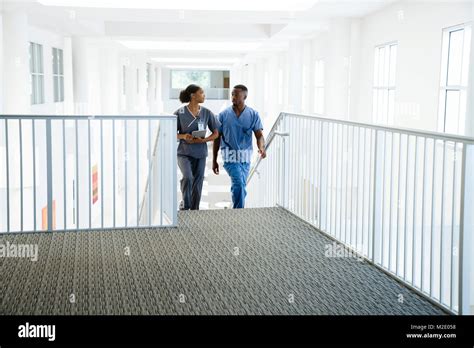 Nurses climbing staircase Stock Photo - Alamy
