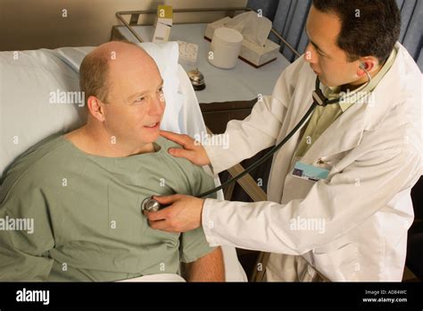 Doctor Checking Patient With A Stethoscope Stock Photo 7620507 Alamy