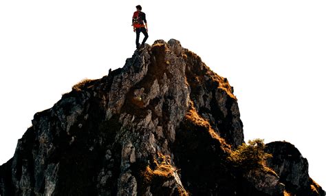 Download A Young Man Reaching The Top Of The Mountain Symbolising