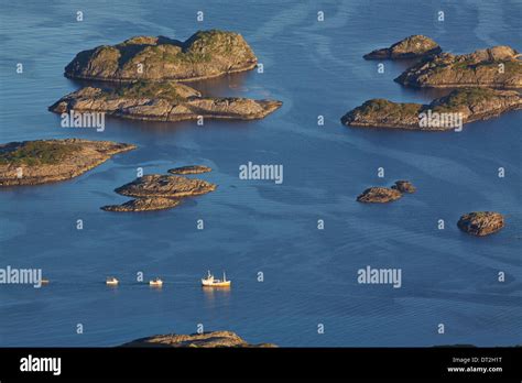 Bird Eye View Of Fishing Boats Sailing Between By Rocky Islets Near