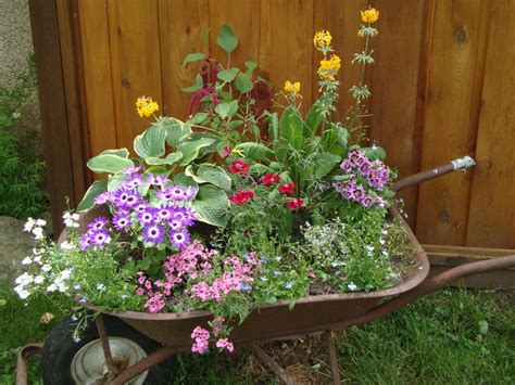 Wheelbarrow Flower Planter Diy Tipped Wheelbarrow Planter The