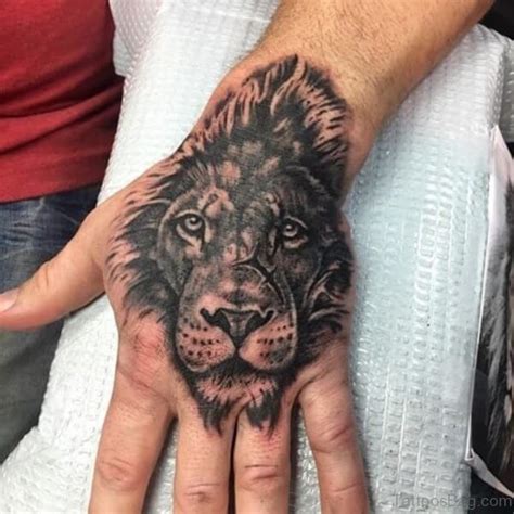 19 Amazing Lion Tattoos On Hand Petpress Lion Tattoo Hand Tattoos