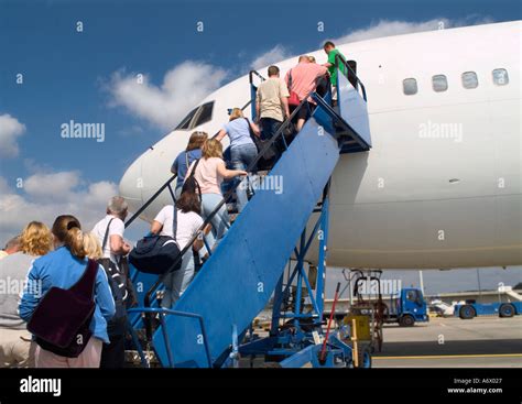 Passengers Boarding Airplane High Resolution Stock Photography And