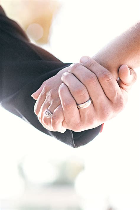 Holding Hands With Wedding Rings
