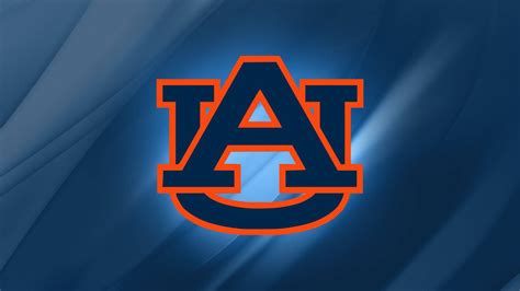 Download Auburn Football With Striped Blue Backdrop Wallpaper