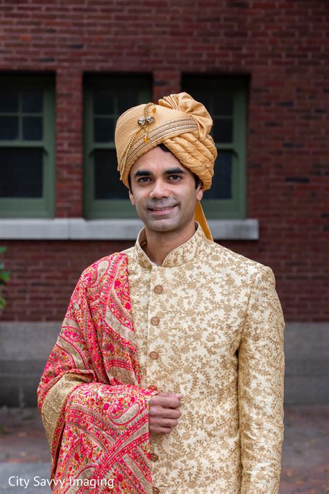 Indian groom wearing his golden turban and sherwani with red dupatta ...