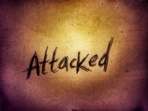 On The Dark Grunge Golden Background Page Paper The Word Attacked Stock
