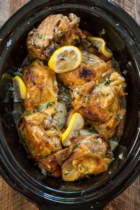 Simply place the chicken in the slow cooker, season the chicken with salt and pepper. Crock Pot Lemon Garlic Chicken | NeighborFood