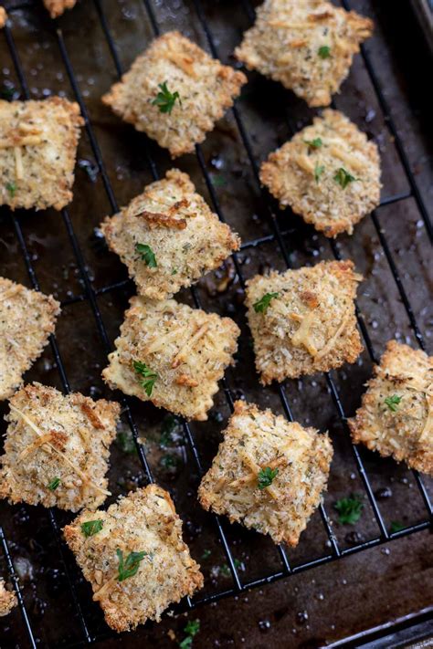 In a 9x13 inch pan layer sauce and cooked ravioli. BAKED TOASTED RAVIOLI RECIPE + WonkyWonderful