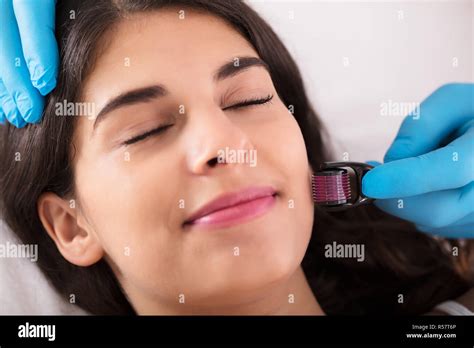 Woman Having Facial Treatment Stock Photo Alamy