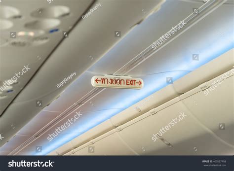Emergency Exit Row Airplane Exit Sign Stock Photo 409557493 Shutterstock