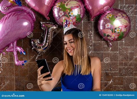 Joyful Birthday Celebration Beautiful Woman Captures The Moment With A Selfie Stock Image