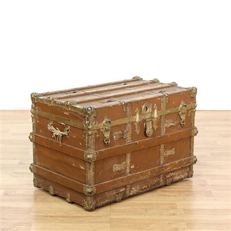 This Antique Steamer Trunk Is Featured In A Solid Wood With A