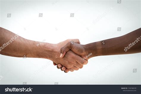 Handshake Between African Caucasian On White Stock Photo 1749788378