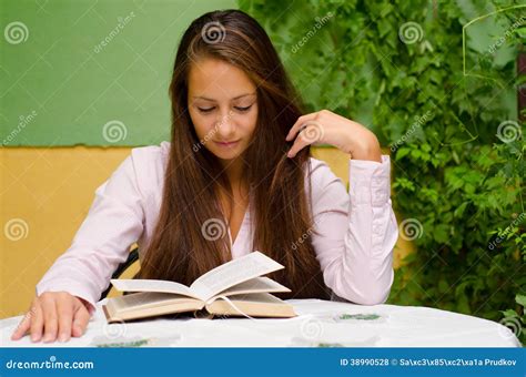 Beautiful Girl Reading Book In The Garden Stock Photo Image Of Girl