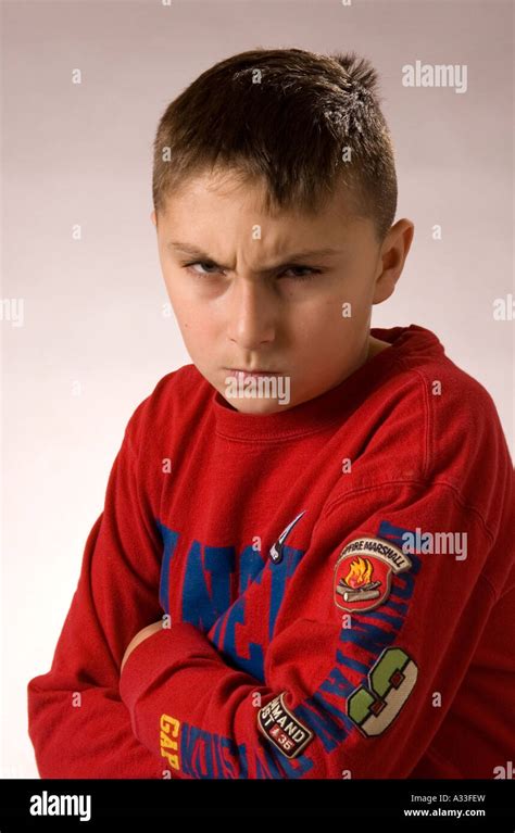 10 Year Old Boy Poses For Camera In An Informal Portrait Setting Stock