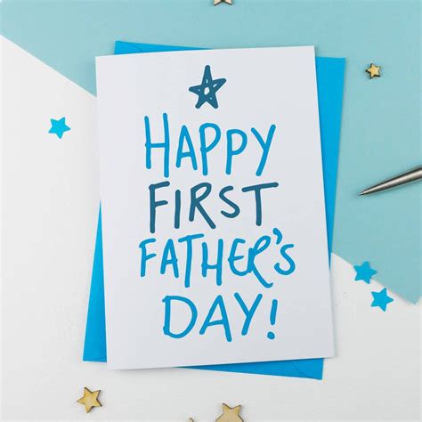 A Happy First Fathers Day Card With Stars And Confetti On The Table