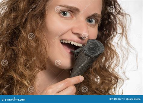 Beautiful Cheerful Girl With Curly Hair Eats Black Ice Cream In Stock Image Image Of Beautiful