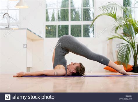 Healthy Young Woman Doing The Plow Pose Yoga Position Stock Photo