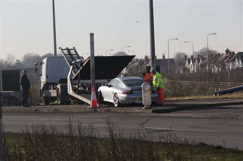 Porsche Crashes Into Central Reservation On A46 Roundabout Near Lord