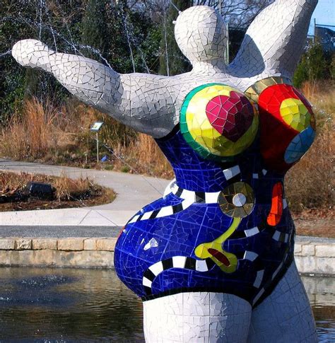 A Statue Made Out Of Mosaic Tiles In The Shape Of A Womans Torso