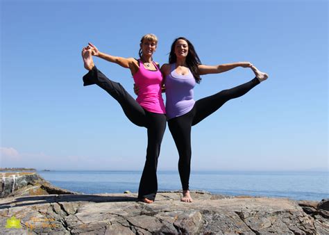 Laura And Ajia Practicing Partner Yoga On The Beach At Clover Point