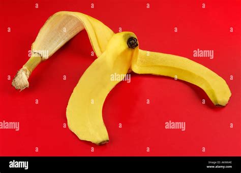 Banana Skin On Red Background Stock Photo Alamy