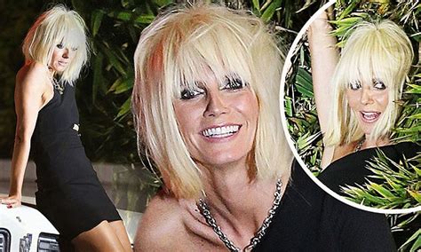 heidi klum slips into the role of tawdry club girl with blonde wig and tight mini dress for