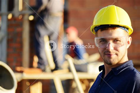 Building Under Construction With Workers Royalty Free Stock Image