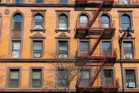 Beautiful Old Apartment Building Exterior With A Fire Escape In New