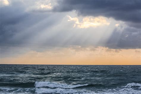 Sun Rays Over Ocean Photograph By Andrea Oconnell