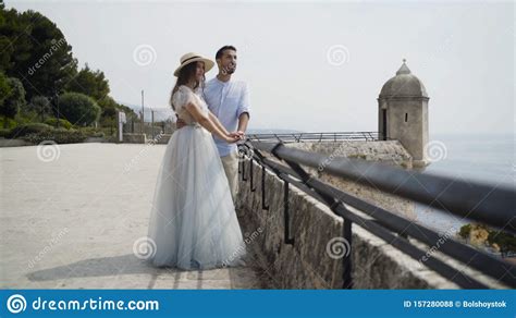 Beautiful Young Couple On Honeymoon Action Newlyweds On Stone