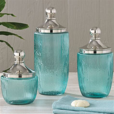 Some turquoise bathroom accessory sets can be shipped to you at home, while others can be picked up in store. Coastal Aqua Ribbed Glass Jar Set