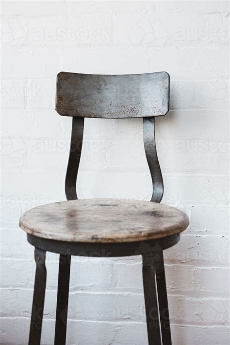 Refined rustic dining chair for formal or casual dining settings. Image of Rustic cafe chair against painted white brick ...