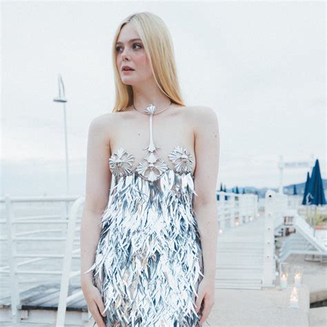 elle fanning rocks a dress with metal pasties at cannes film festival 2023