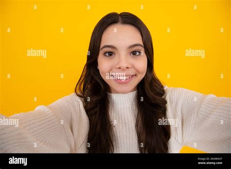 Funny Teenager Girl Making Selfie Posing On Yellow Background Stock